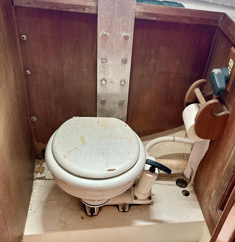 Slide: The Image of Marine toilet in a 1982 Schock NY 36 sailboat. - 16
