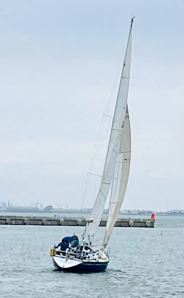 Slide: The Image of 1982 Schock NY 36 sailboat on calm waters. - 2