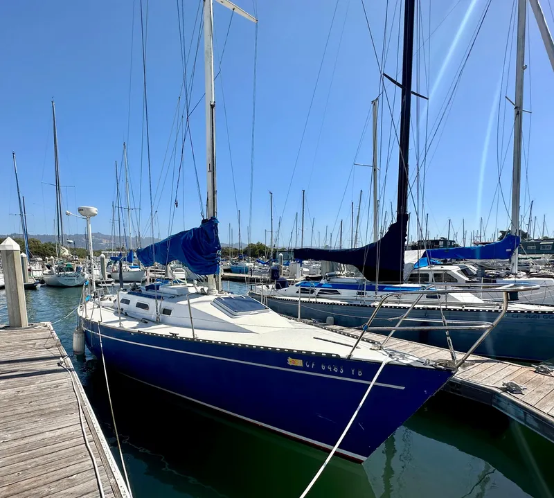 Slide: The Image of 1982 Schock NY 36 sailboat docked in marina. - 4
