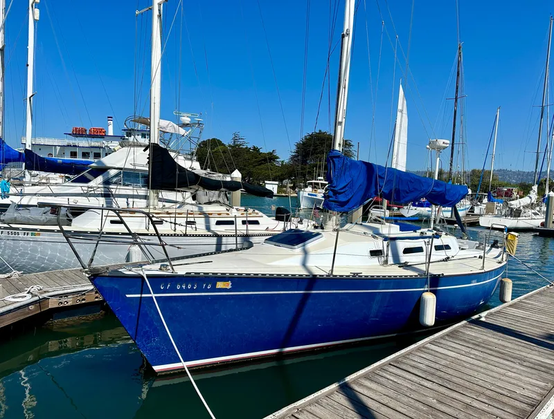 Slide: The Image of Blue 1982 Schock NY 36 sailboat docked in marina. - 5