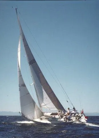 Slide: The Image of 1982 Schock NY 36 sailboat navigating open waters. - 7