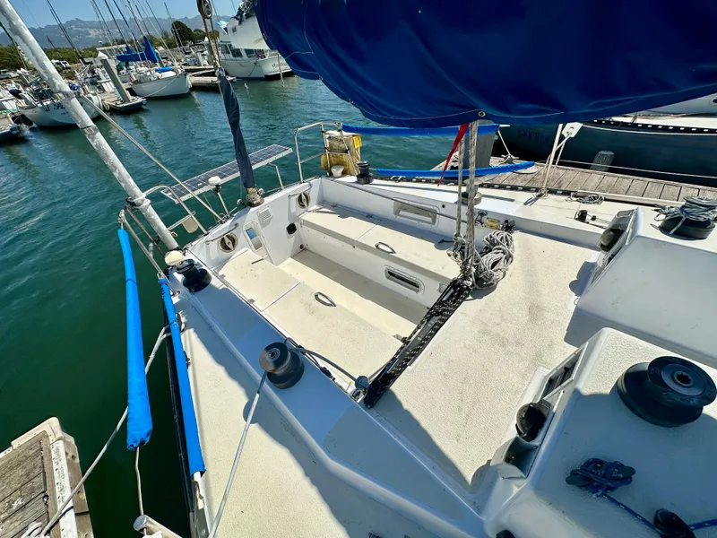 Slide: The Image of 1982 Schock NY 36 sailboat docked in marina. - 9