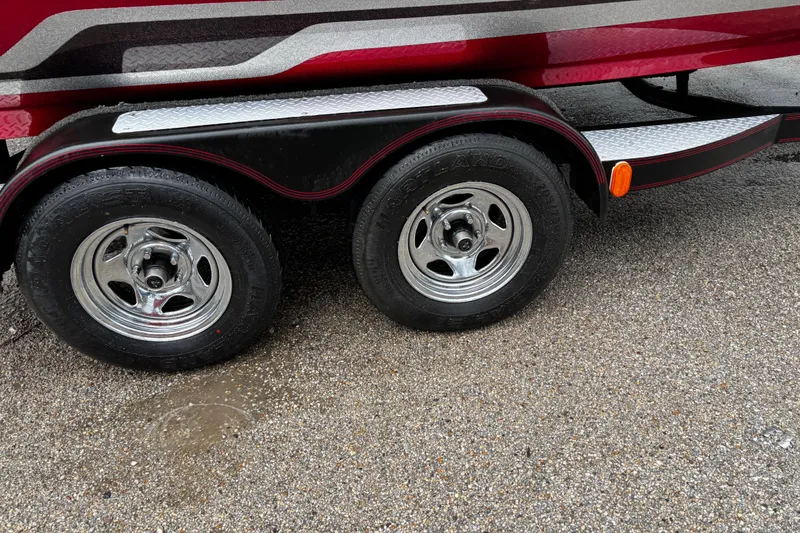 Slide: The Image of 2012 Skeeter ZX200 boat propeller on wet pavement background. - 11