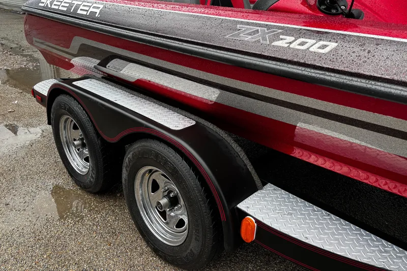 Slide: The Image of 2012 Skeeter ZX200 boat with Yamaha motor mount, wet from rain. - 14