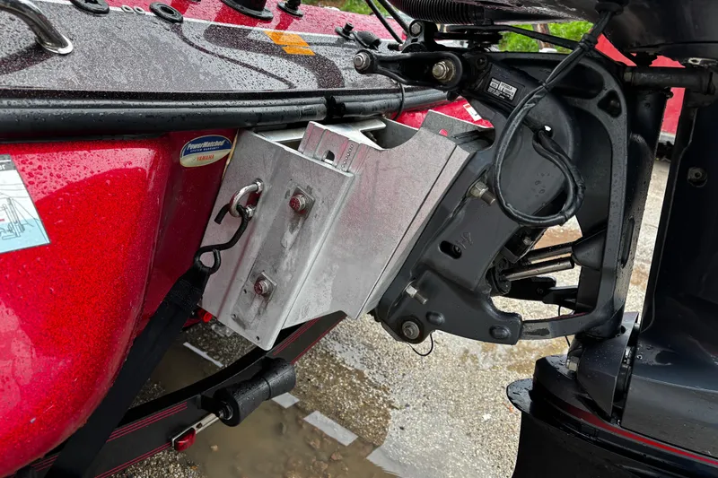 Slide: The Image of 2012 Skeeter ZX200 boat interior with red and gray seats, dual consoles, and steering wheel. - 18