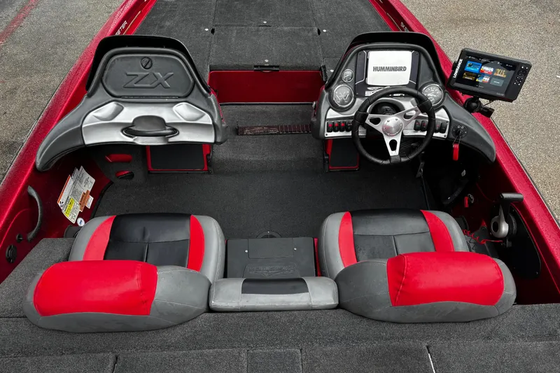 Slide: The Image of 2012 Skeeter ZX200 boat storage compartment with open hatch, showcasing interior space. - 21