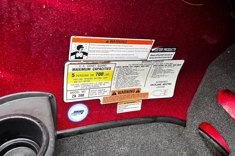 Slide: The Image of Interior of a 2012 Skeeter ZX200 boat showing steering wheel and foot pedal. - 29