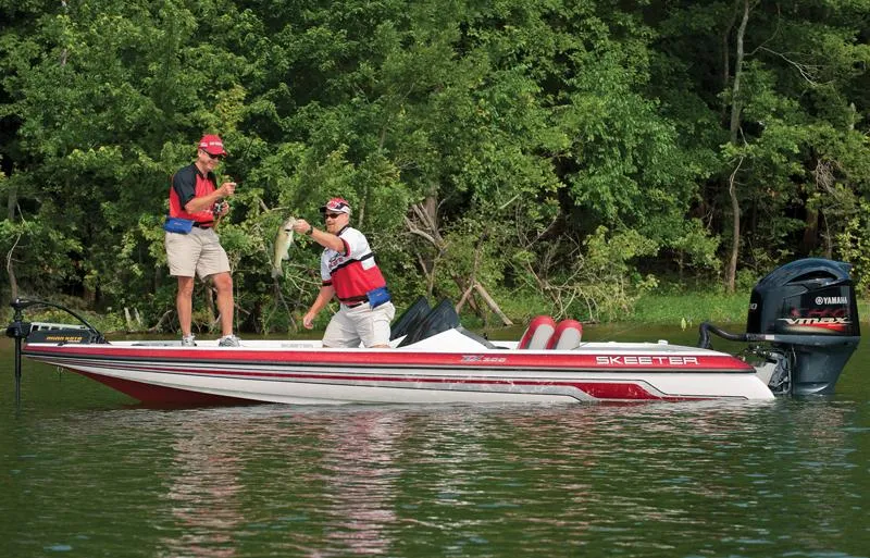 Slide: The Image of 2012 Skeeter ZX200 boat with Yamaha VMAX engine, parked outdoors. - 3