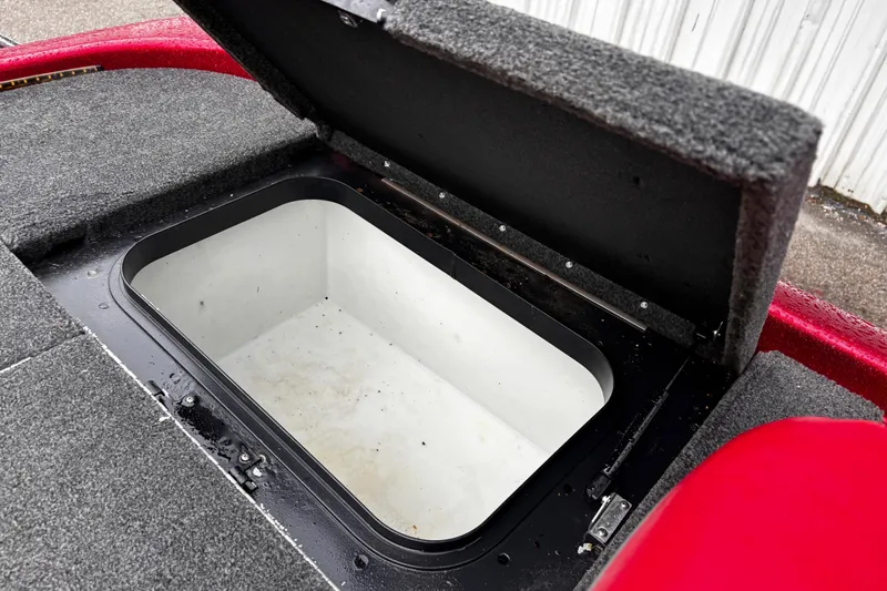 Slide: The Image of 2012 Skeeter ZX200 trailer with spare tire and winch on asphalt surface. - 32