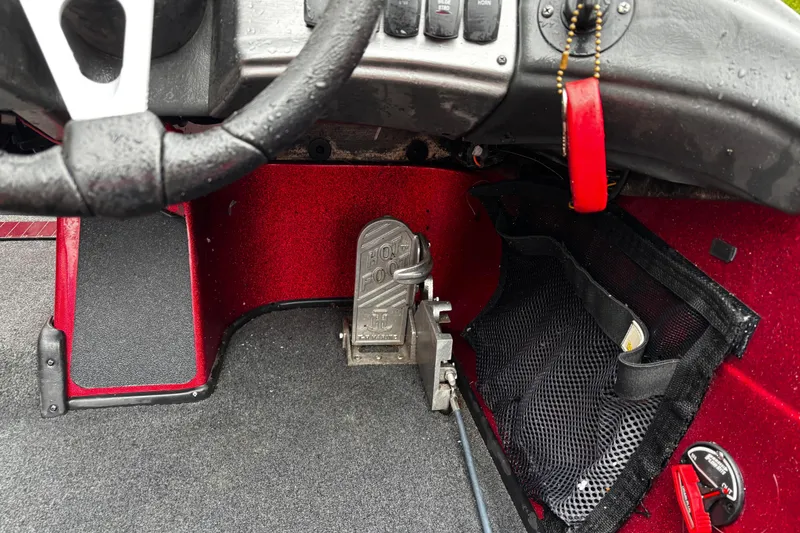 Slide: The Image of 2012 Skeeter ZX200 bass boat on trailer, parked outdoors under cloudy sky. - 34