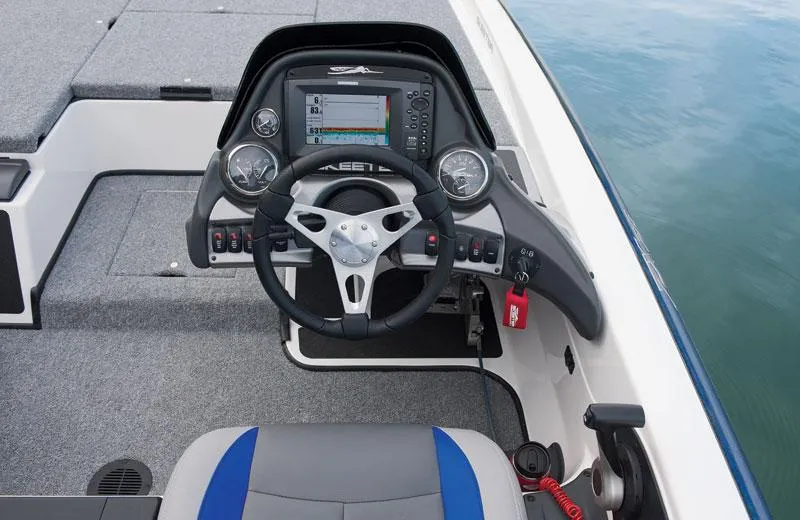 Slide: The Image of 2012 Skeeter ZX200 boat with powerful 200 horsepower engine, parked outdoors. - 4