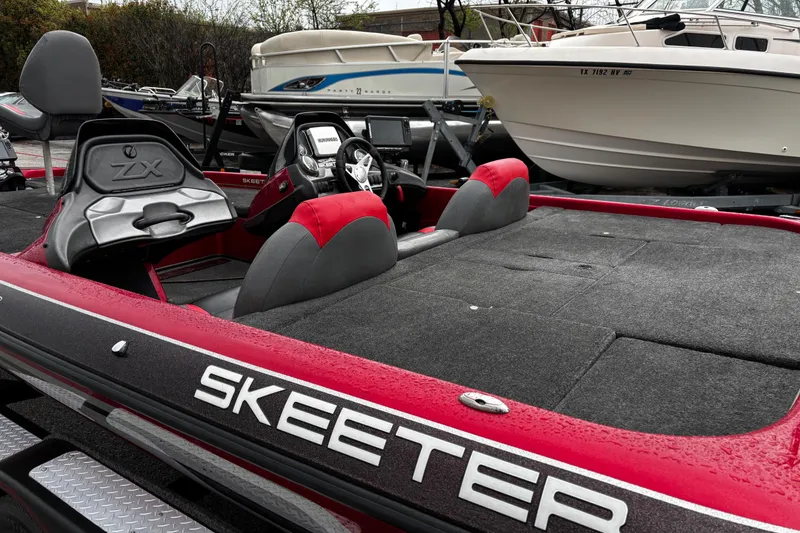 Slide: The Image of 2012 Skeeter ZX200 bass boat with Yamaha VMAX engine on trailer. - 44
