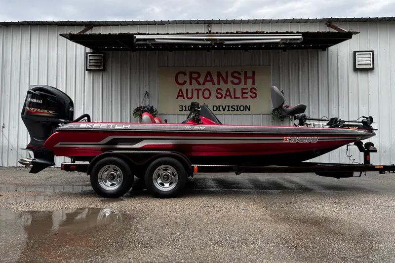 Slide: The Image of 2012 Skeeter ZX200 bass boat interior with steering console and electronics. - 8