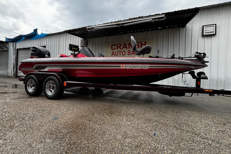Slide: The Image of 2012 Skeeter ZX200 boat with Minn Kota Fortrex trolling motor, red and black design. - 9