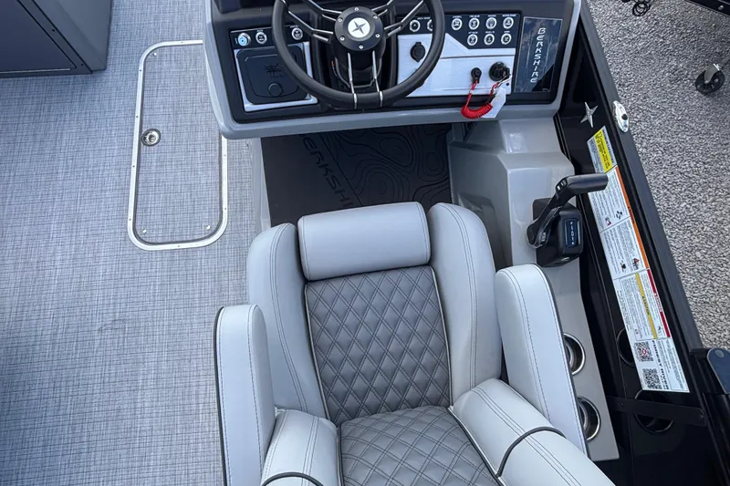Slide: The Image of 2026 Berkshire 23RFX STS boat cockpit with steering wheel and luxurious seating. - 10