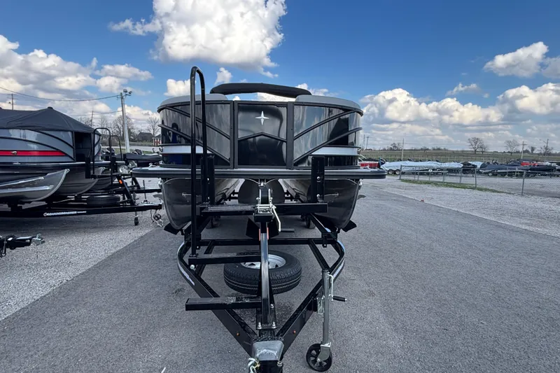 Slide: The Image of 2026 Berkshire 23RFX STS pontoon boat on trailer under blue sky. - 6