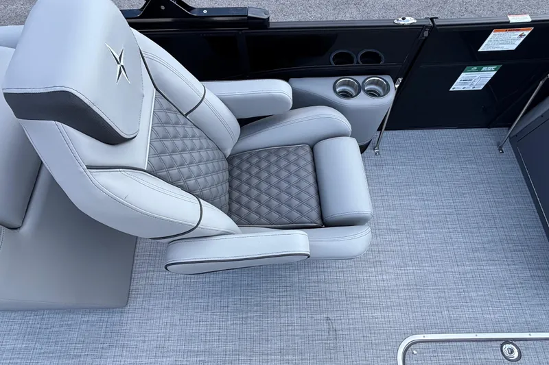 Slide: The Image of Luxurious seating on 2026 Berkshire 23RFX STS boat with quilted design and cup holders. - 9