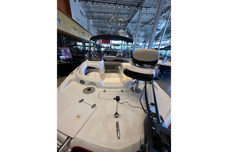 Slide: The Image of 2013 Tahoe 195 I/O boat interior with seating and controls in showroom. - 6
