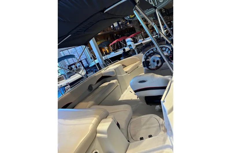 Slide: The Image of Interior view of a 2013 Tahoe 195 I/O boat with seating and steering wheel. - 7