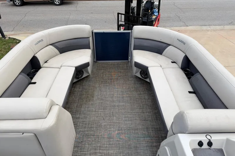 Slide: The Image of 2023 Harris Cruiser 230 boat interior with spacious seating and modern design. - 4
