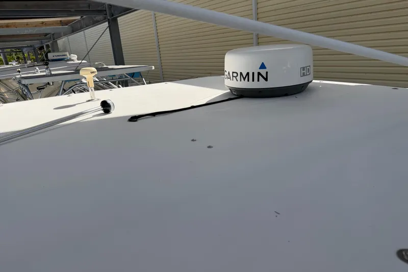 Slide: The Image of 2003 Wellcraft 270 Coastal O/B boat with Garmin HD radar on deck. - 16