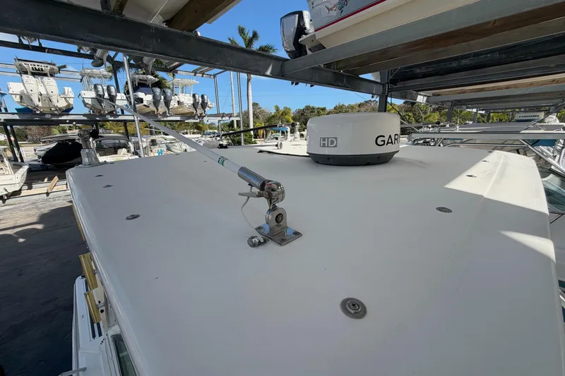 Slide: The Image of 2003 Wellcraft 270 Coastal O/B boat with Garmin radar, docked in a marina. - 18