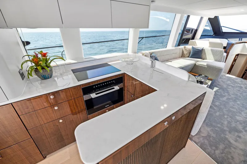 Slide: The Image of Luxurious interior of 2024 Fairline Squadron 68 yacht with modern kitchen and ocean view. - 18