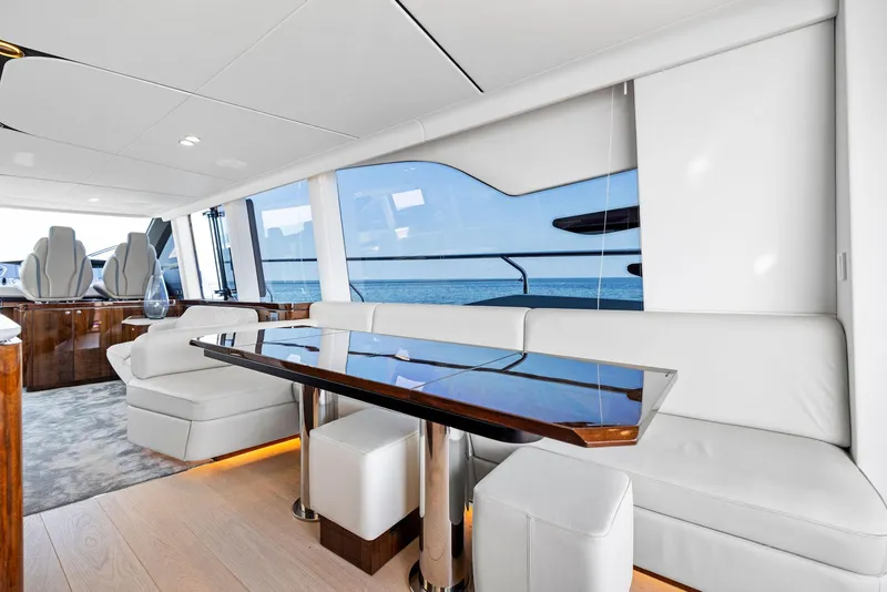 Slide: The Image of Luxurious interior of 2024 Fairline Squadron 68 yacht with elegant seating and ocean view. - 20