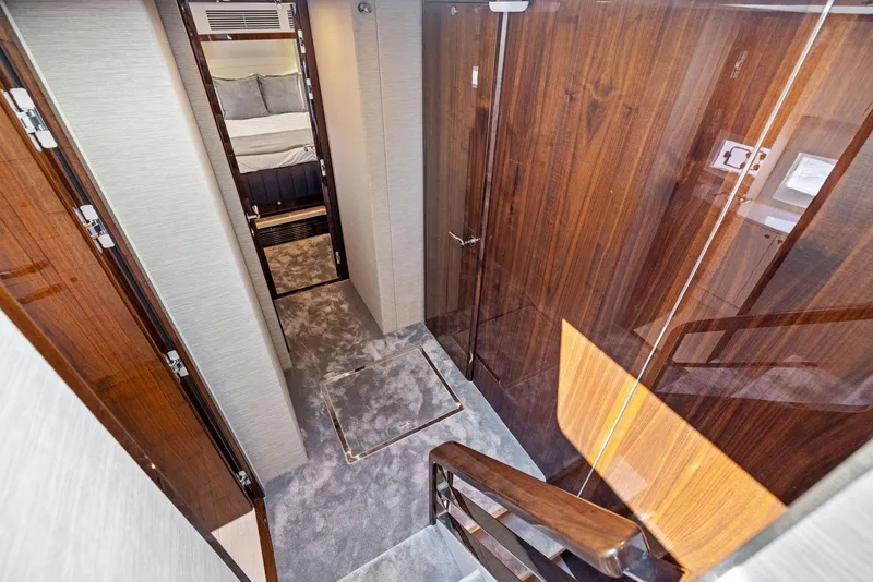 Slide: The Image of Interior hallway of 2024 Fairline Squadron 68 yacht with luxurious wood paneling. - 27