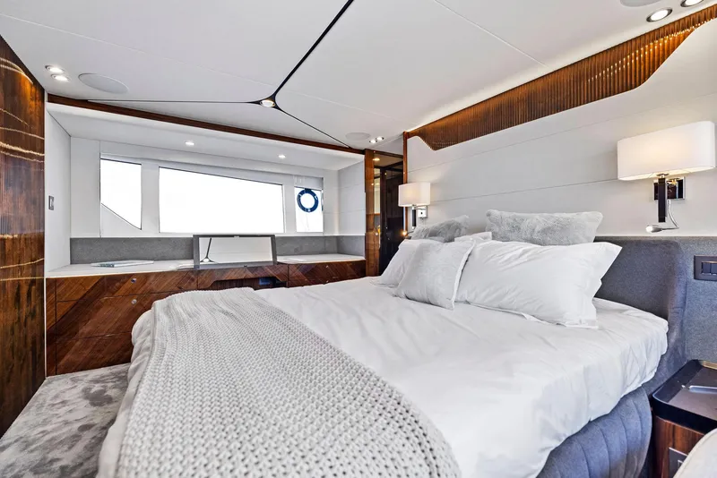 Slide: The Image of Luxurious bedroom interior of 2027 Fairline Squadron 68 yacht with modern design and cozy bedding. - 31