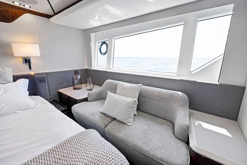 Slide: The Image of Luxurious interior of 2027 Fairline Squadron 68 yacht with elegant seating and ocean view. - 34