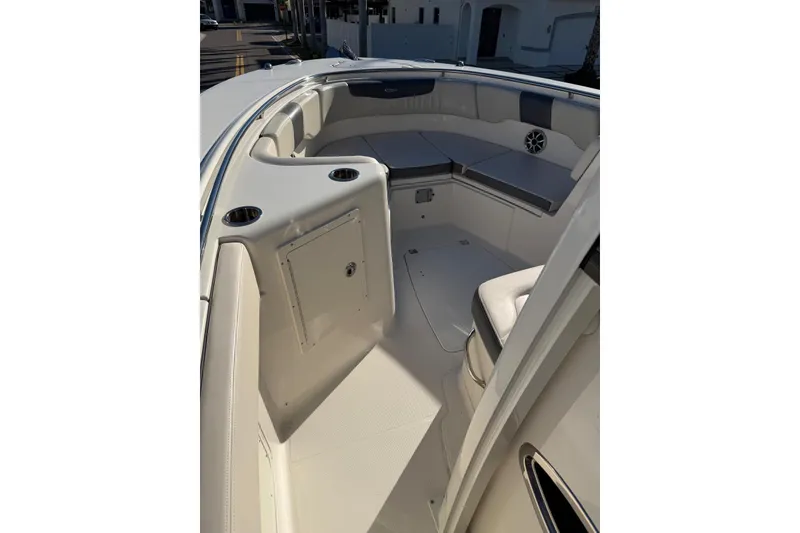 Slide: The Image of 2017 Robalo R302 Center Console boat interior with seating and storage compartments. - 8