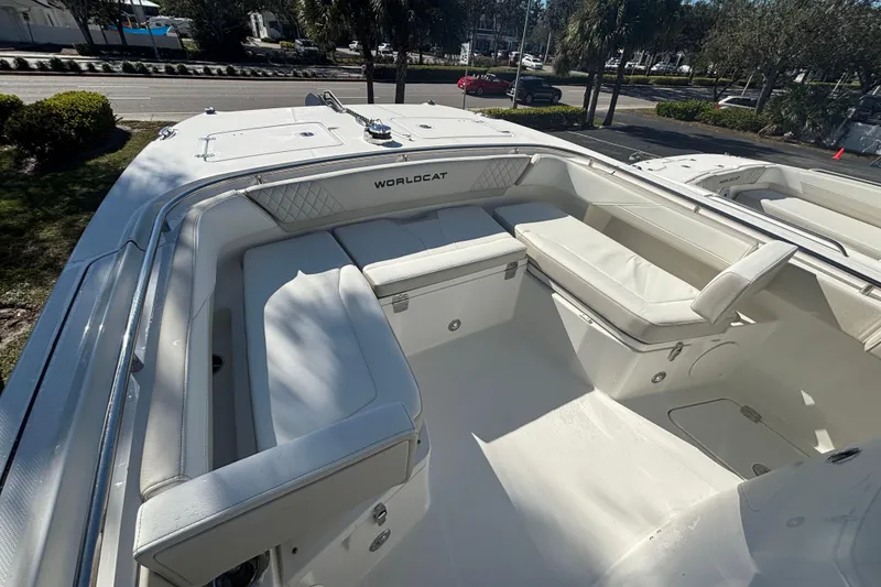 Slide: The Image of 2026 World Cat 265 CC-X boat interior with white seating and storage compartments. - 4
