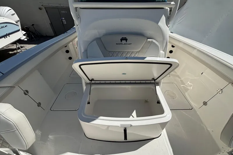 Slide: The Image of 2025 World Cat 325 CC boat interior with open storage compartment. - 11
