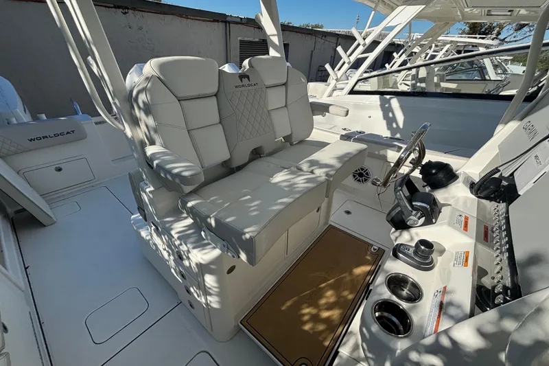Slide: The Image of 2025 World Cat 325 CC boat interior with luxurious seating and modern controls. - 2