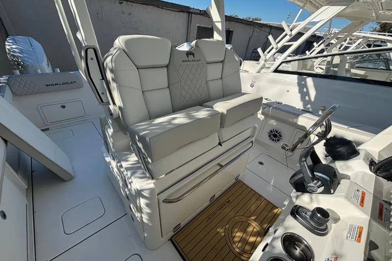 Slide: The Image of 2025 World Cat 325 CC boat interior with luxurious seating and modern helm controls. - 4