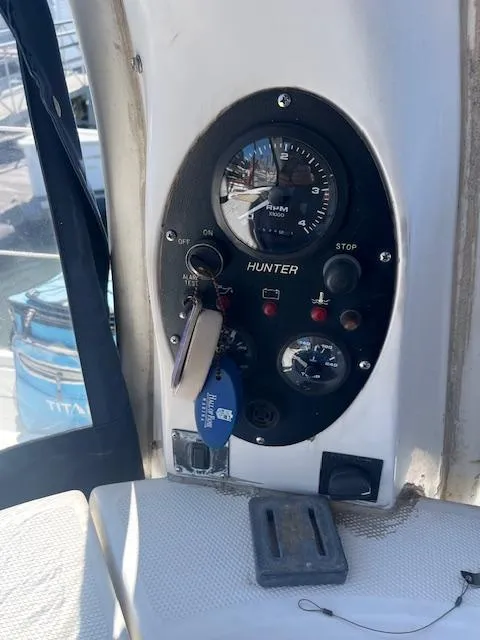 Slide: The Image of Control panel of a 1999 Hunter Passage 450 sailboat with gauges and ignition keys. - 4