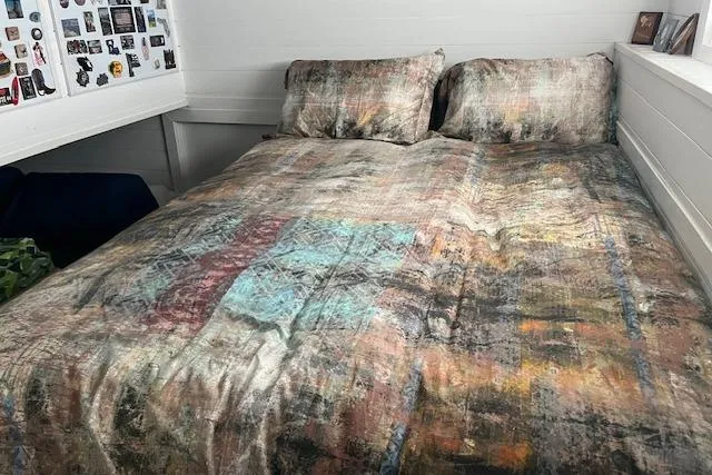 Slide: The Image of Cozy Harbor Cottage bedroom with abstract-patterned bedding, 2021 model. - 14