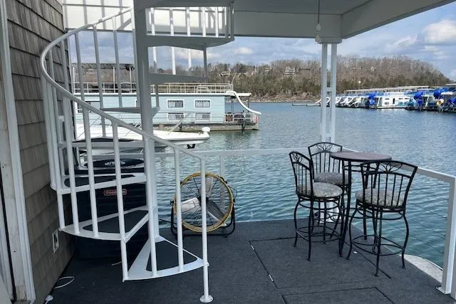 Slide: The Image of Spiral staircase on a Harbor Cottage houseboat deck with lake view, 2021 model. - 30