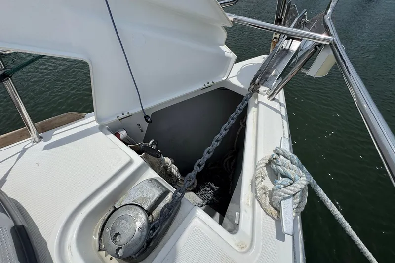 Slide: The Image of Anchor locker of 2018 Jeanneau Sun Odyssey 389 sailboat with chain and rope. - 11