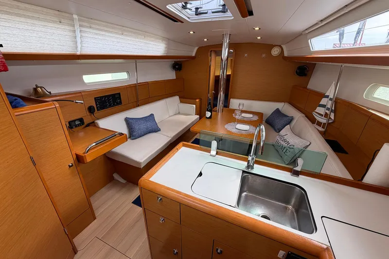 Slide: The Image of Interior of 2018 Jeanneau Sun Odyssey 389 sailboat with cozy seating and modern kitchen. - 30