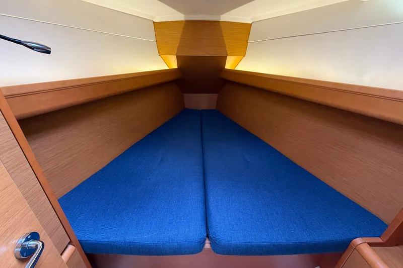 Slide: The Image of Cozy cabin interior of 2018 Jeanneau Sun Odyssey 389 with blue cushions. - 38
