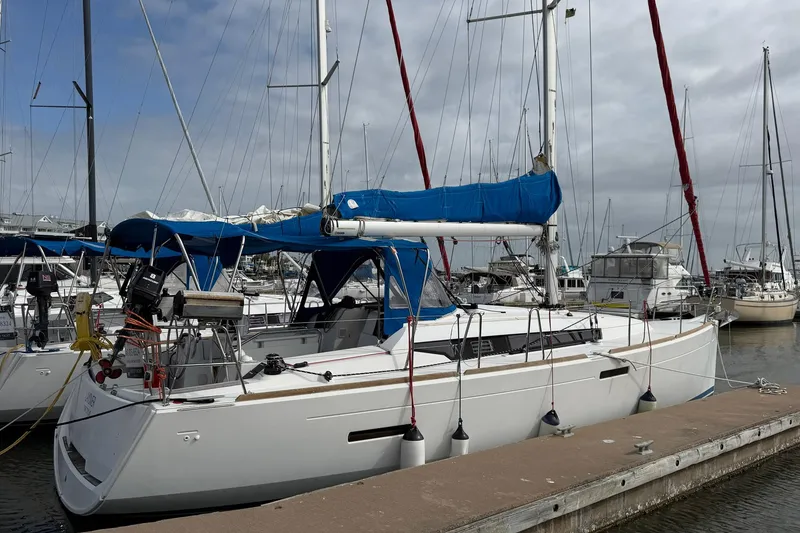 Slide: The Image of 2018 Jeanneau Sun Odyssey 389 sailboat docked at marina. - 4