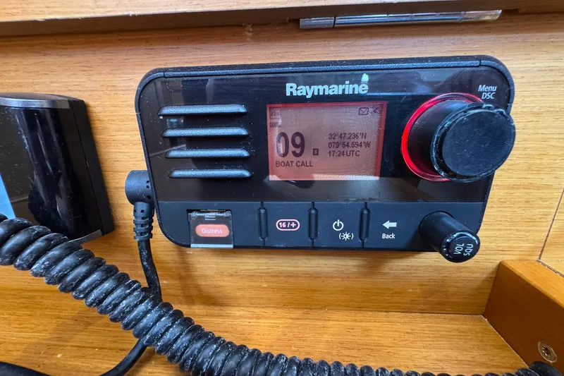 Slide: The Image of Raymarine radio on 2018 Jeanneau Sun Odyssey 389, displaying coordinates and boat call. - 46