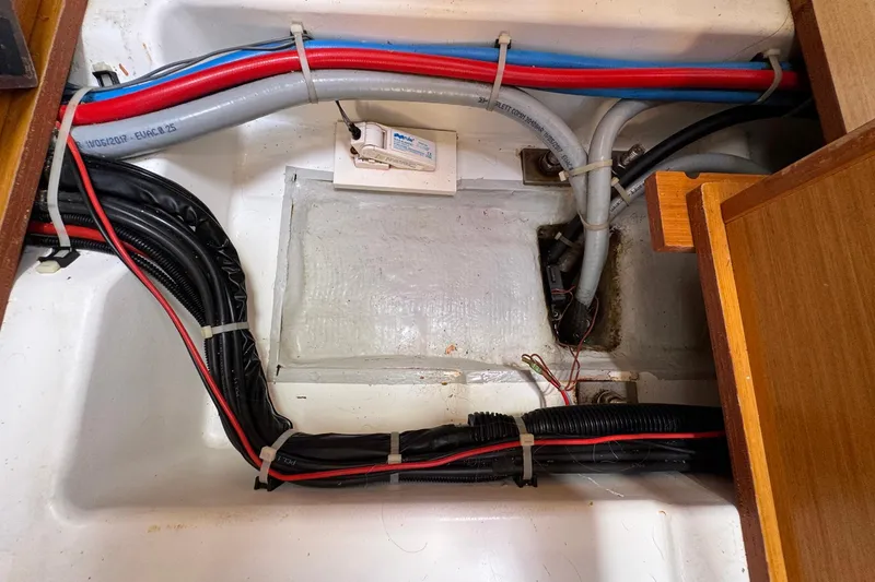 Slide: The Image of Electrical wiring and plumbing in a 2018 Jeanneau Sun Odyssey 389 sailboat. - 51