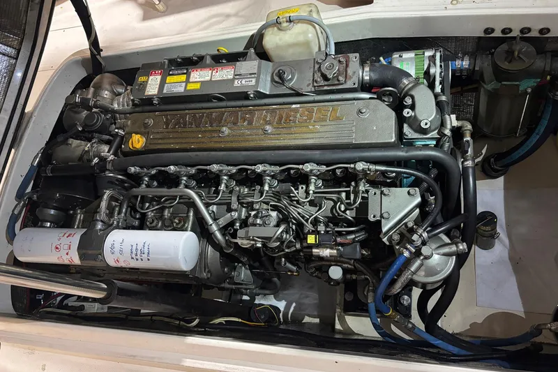 Slide: The Image of Engine of a 2004 Hinckley 36 Picnic Boat EP, showcasing Yanmar diesel components. - 12