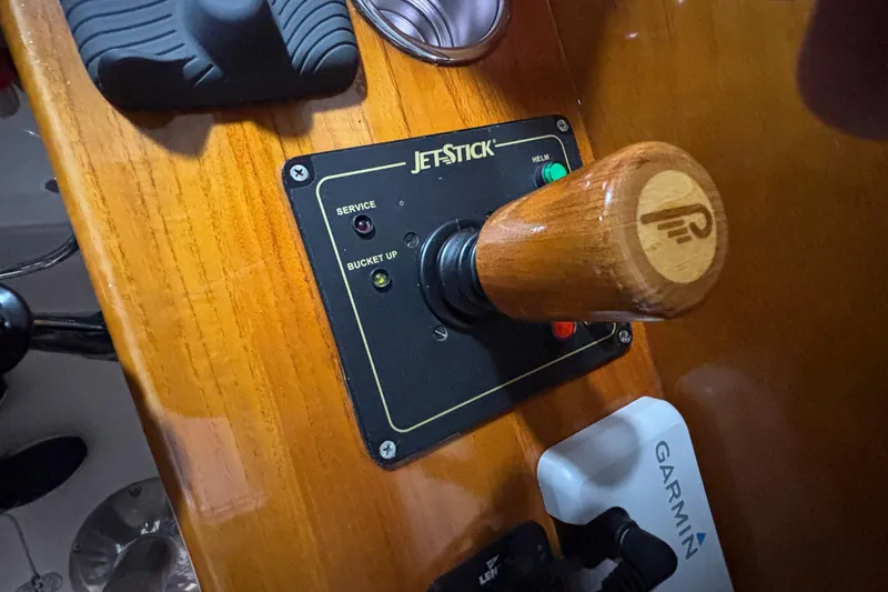 Slide: The Image of Hinckley 36 Picnic Boat EP 2004 jetstick control panel with wooden handle and Garmin device. - 8