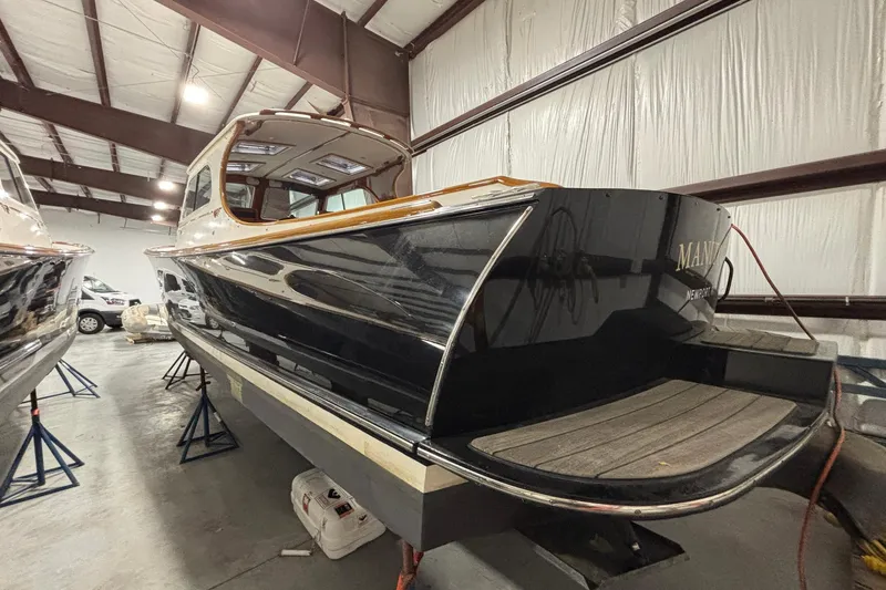Slide: The Image of 2004 Hinckley 36 Picnic Boat EP in storage, showcasing sleek design and craftsmanship. - 2