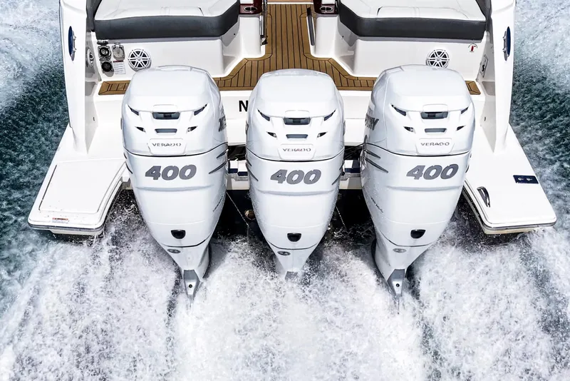 Slide: The Image of 2022 Tiara Yachts 38 LX with triple 400 Verado engines on water. - 11