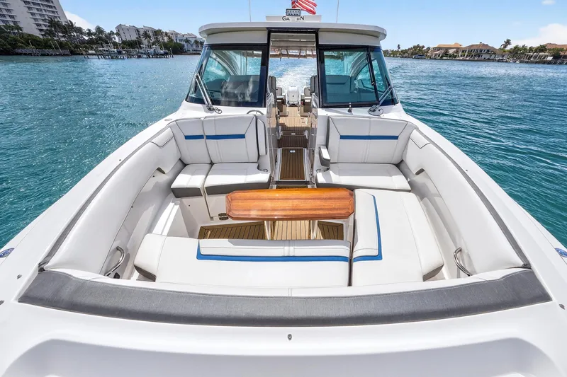 Slide: The Image of 2022 Tiara Yachts 38 LX with spacious seating and elegant design on open water. - 12